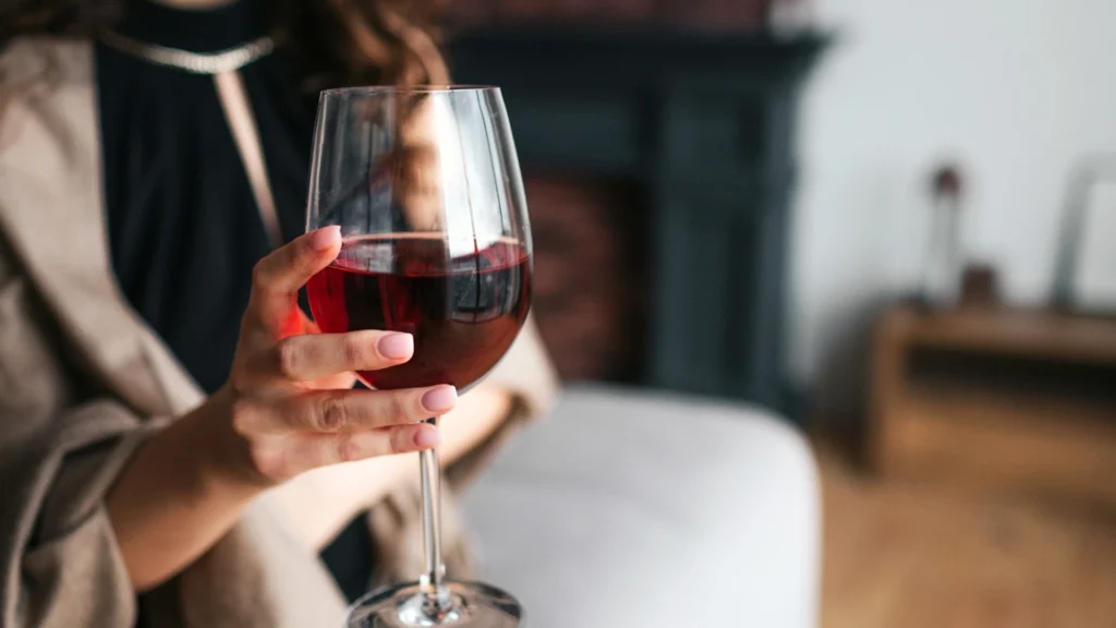A woman enjoying the best Malbec under $30